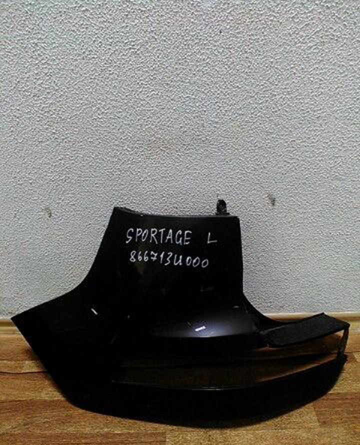 Клык зад бампера лев Kia Sportage oem 866713u000